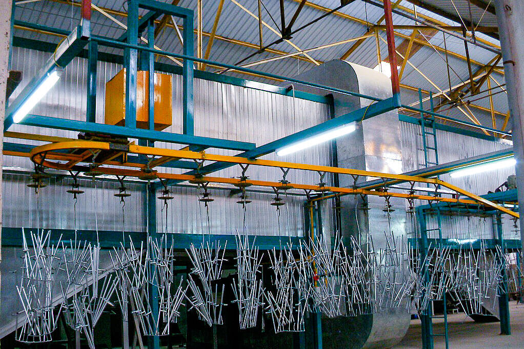 Rail system for suspended part transport through process zones