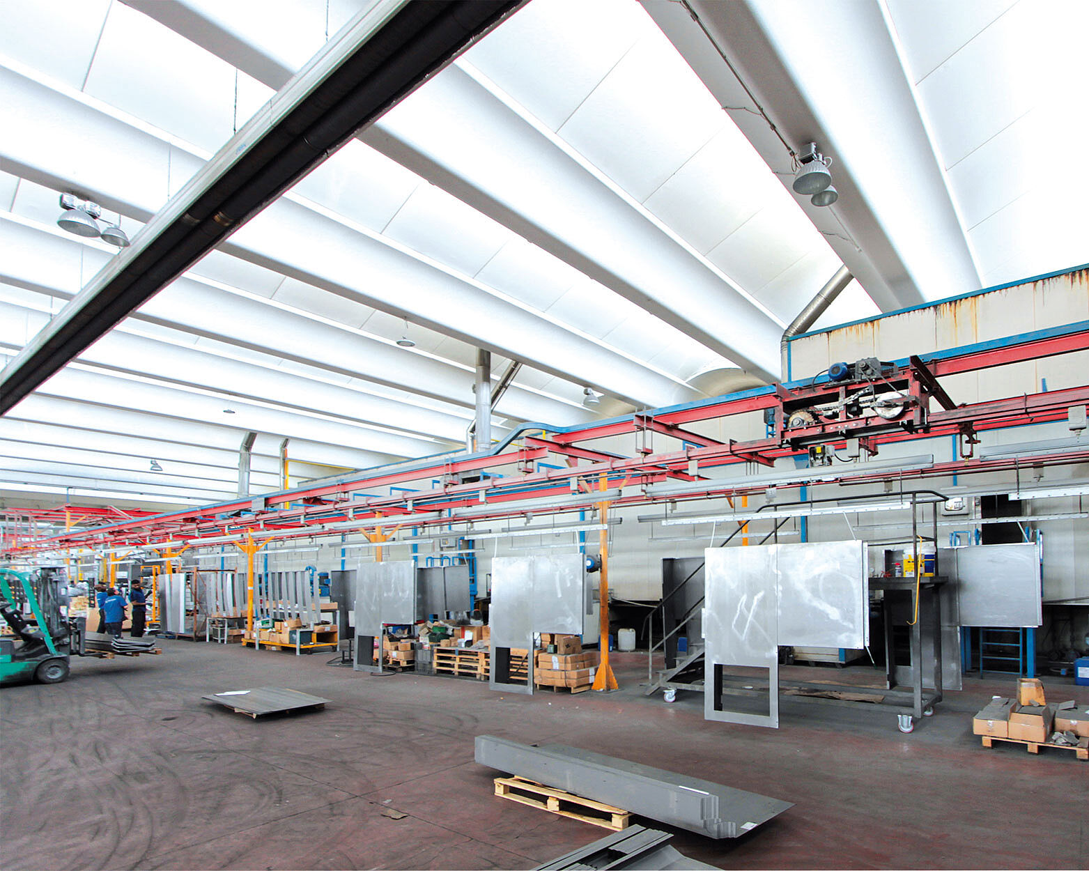 workpieces are moving into the powder booth