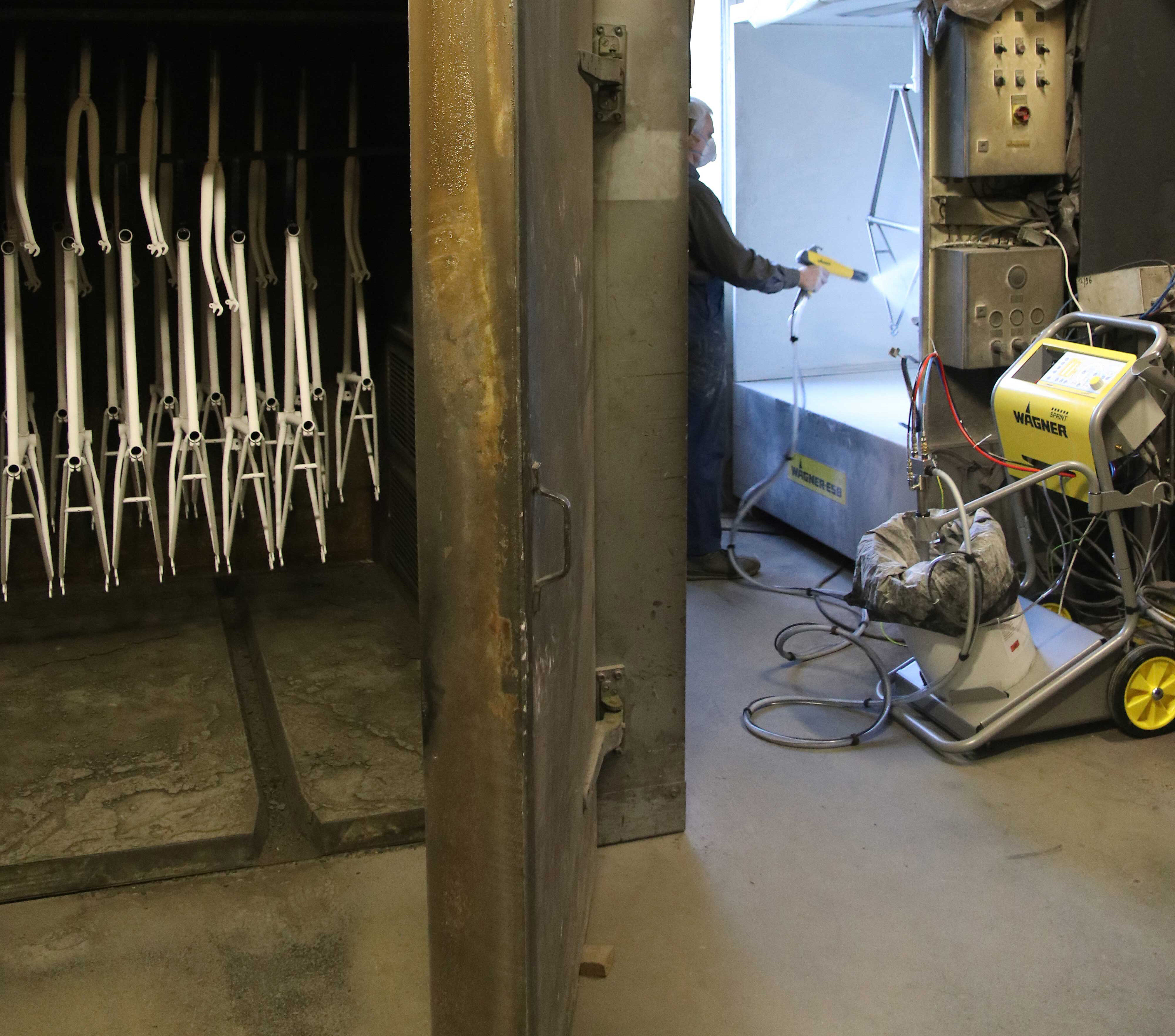 manual powder coating of bicycle frames