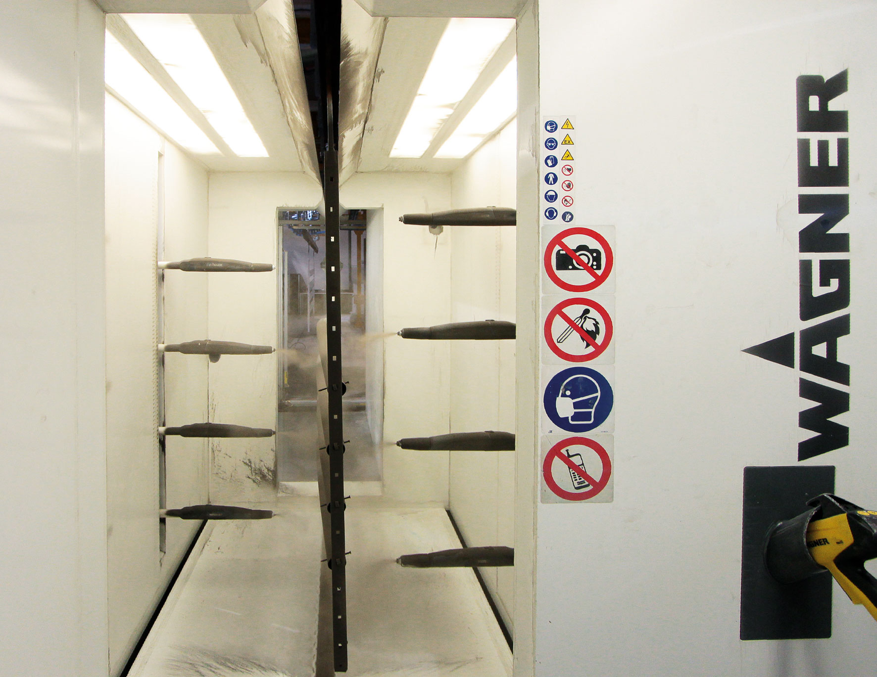 powder coating booth with metal workpiece